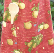 aprons/DLA0125ApronFabricRustOrangesLemonsDetail.jpg